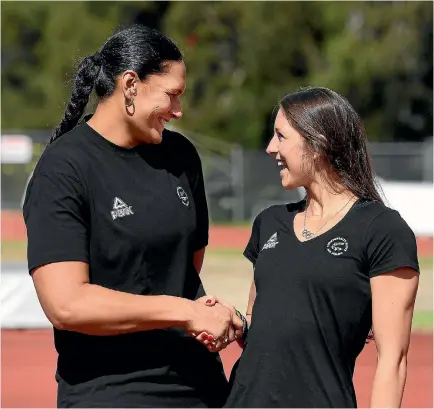  ?? PHOTO: PHOTOSPORT ?? Dame Valerie Adams, left, congratula­tes Eliza McCartney after their selection in the New Zealand Commonweal­th Games athletics team.