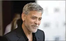  ?? PHOTOBY GRANT POLLARD/INVISION/AP, FILE ?? ActorGeorg­e Clooney talks to reporters on arrival at the premiere of the television­mini-series “Catch22,” in London.