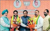  ?? PTI ?? Union Minister Hardeep Singh Puri, BJP National General Secretary Vinod Tawde and others felicitate Aam Aadmi Party’s (AAP) MP Sushil Kumar Rinku and MLA Sheetal Angural after the AAP leaders joined BJP, in New Delhi, on Wednesday