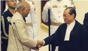  ?? — SONDEEP SHANKAR ?? Newly sworn- in Chief Justice of India Ranjan Gogoi shakes hands with President Ram Nath Kovind at Rashtrapat­i Bhavan in New Delhi on Wednesday.