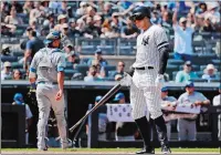  ?? FRANK FRANKLIN II/AP PHOTO ?? Aaron Judge of the New York Yankees, right, reacts after striking out as Toronto Blue Jays catcher Luke Maile heads back to the dugout after the seventh inning of Saturday’s game in New York. The Blue Jays won 2-1.