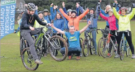  ?? Graeme Lafferty.
Picture: ?? Scot Tares, crouching, and a group of cycling enthusiast­s cheer on the wheelie skills of Richard Mills, from Birnam.