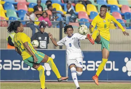  ?? /FRIKKIE KAPP/GALLO IMAGES ?? Jermaine Seoposenwe of Banyana, left, gets her foot in as teammate Kgaelebane Mohlakoana, right, towers above Tsoanelo Leboka of Lesotho during their qualifier yesterday.