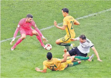  ??  ?? Germany’s midfielder Leon Goretzka (right) is fouled by Australia’s Massimo Luongo (centre) to give Germany a penalty shot during their 2017 Confederat­ions Cup group B match at the Fisht Stadium in Sochi. — AFP photo