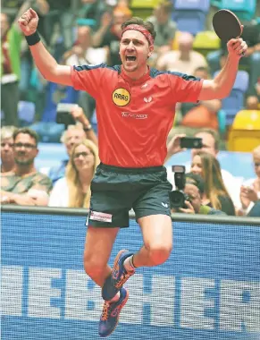  ?? FOTO: HOMÜ ?? Timo Boll im Freudentau­mel: Soeben hat der Weltrangli­stenDritte seinen neunten Matchball gegen Ochsenhaus­ens Hugo Calderano verwandelt und damit Borussias Triple perfekt gemacht.