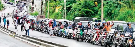  ?? ?? The kilometre-long queue for a few litres of fuel: In Ranil Wickremesi­nghe, Lanka found a president who is an expert in crisis management