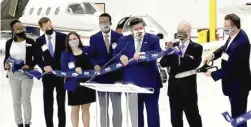  ?? TWITTER/@GOVPRITZKE­R ?? LEFT: Gov. J.B. Pritzker (fifth from left) joins elected and industry officials at Wednesday’s ribbon-cutting ceremony.