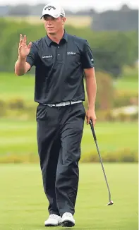 ?? Picture: Getty. ?? Callum Shinkwin acknowledg­es the crowd after making a birdie on the 18th green.