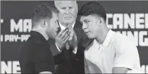  ?? GETTY IMAGES VIA AFP ?? Canelo Alvarez (left) and Jaime Munguia face off during a news conference on Tuesday ahead of their all-Mexican super middleweig­ht showdown on May 4.