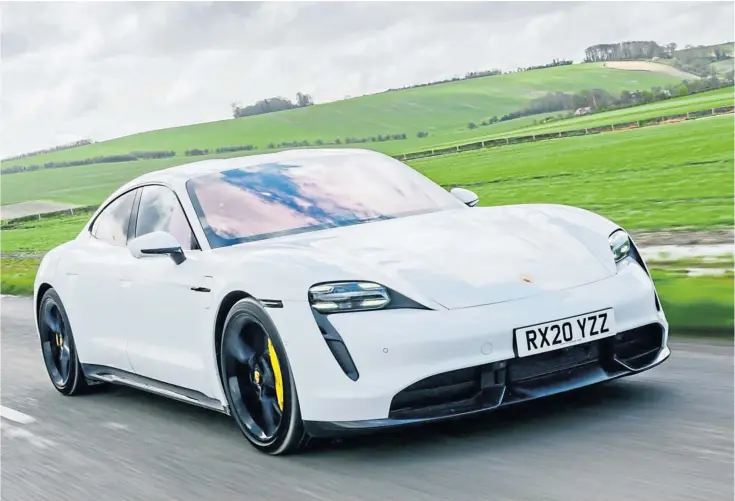  ?? ?? E-MOTION: The range of all-electric vehicle options is growing, with impressive models such as this Porsche Taycan turning heads and eating up the miles across the UK.