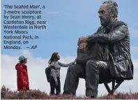  ?? — AP ?? ‘The Seated Man’, a 3-metre sculpture by Sean Henry, at Castleton Rigg, near Westerdale in North York Moors National Park, in England, on Monday.