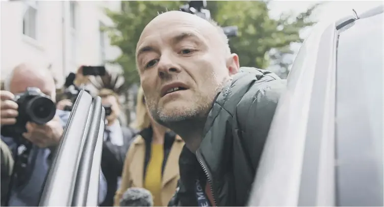  ?? – who later publicly backed him ?? 0 Downing Street adviser Dominic Cummings mobbed by reporters and cameras as he leaves his London home yesterday to head to No10 for talks with Boris Johnson