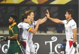  ?? — AFP ?? Belgium’s Alexander Hendrickx ( right) celebrates with teammates after scoring against South Africa on Saturday. Belgium won 5- 1.