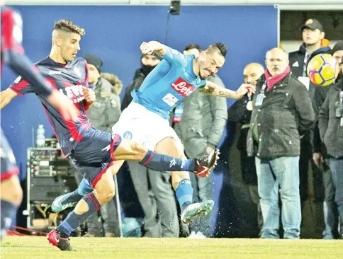  ?? — AFP photo ?? Napoli’s Slovakian midfielder Marek Hamsik (R) fights for the ball with Crotone’s Italian defender Mario Sampirisi during the Italian Serie A football match FC Crotone vs SSC Napoli on December 29 2017 at the Ezio Scida Stadium.