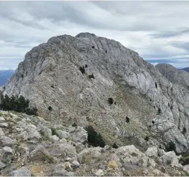  ?? ?? After climbing the rock wall the summit ridge awaits straight ahead