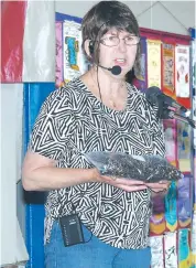  ??  ?? Commerical African violet grower Annette Kennedy passes on tips to visitors at the 2015 Garden and Home Expo