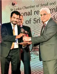  ??  ?? Magline Managing Director Thusitha Perera receiving award from Central Bank Governor