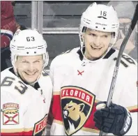  ?? AP PHOTO ?? Florida Panthers’ Aleksander Barkov, right, celebrates with teammate Evgenii Dadonov after scoring against the Montreal Canadiens during NHL action Monday night in Montreal.