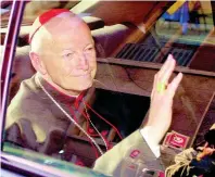  ?? AP PHOTOS ?? In this April 23, 2002 file photo Cardinal Theodore McCarrick of the Archdioces­e of Washington waves as he arrives at the Vatican in a limousine.