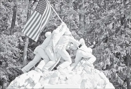  ?? ?? TRESPASS: A WWII tribute stands near the Quantico Marine Corps Base outside DC, where two men in a truck tried to force their way inside.