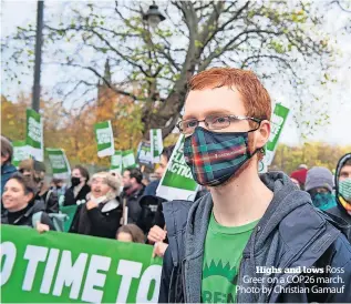  ?? ?? Highs and lows Ross Greer on a COP26 march. Photo by Christian Gamauf