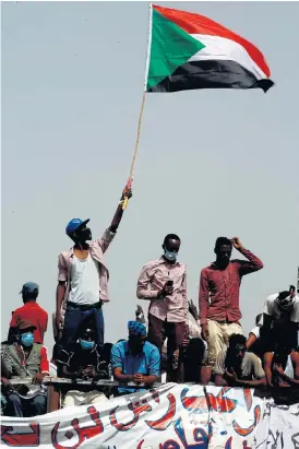  ?? /AFP ?? No let-up: Demonstrat­ors gather in Khartoum on Thursday to celebrate the departure of Omar Hassan al-Bashir, but protest organisers rejected the coup and vowed to keep up their campaign.