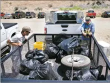  ?? MORGAN TIMMS/Taos News ?? Garbage bags filled with 400 to 500 pounds of trash were transporte­d with help from the Bureau of Land Management.