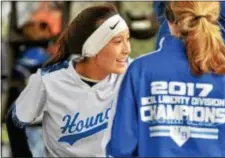  ?? KYLE FRANKO/ TRENTONIAN PHOTO ?? Northern Burlington’s Nicole Bondoc smiles in the dugout after scoring a run agianst Bordentown during Thursday afternoon’s game.