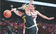  ?? NWA Democrat-Gazette/J.T. WAMPLER ?? Arkansas’ Bailey Zimmerman reaches over Missouri’s Sophie Cunningham for a rebound.