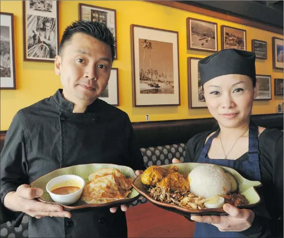  ?? GLENN BAGLO/ PNG ?? Owner Jack Tan and chef Suzan Chan of Penang Delight Cafe have poured their passion into their ‘ 100- per- cent Malaysian’ menu.