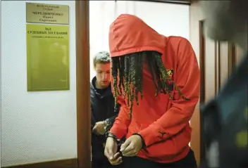  ?? ALEXANDER ZEMLIANICH­ENKO — THE ASSOCIATED PRESS ?? WNBA star and two-time Olympic gold medalist Brittney Griner leaves a courtroom after a hearing in Khimki, just outside Moscow, on Friday. Griner was detained at the Moscow airport in February after vape cartridges containing oil derived from cannabis were allegedly found in her luggage, which could carry a maximum penalty of 10years in prison.