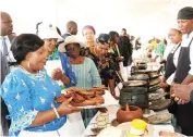  ?? ?? First Lady Dr Auxillia Mnangagwa, Deputy Minister Barbra Rwodzi, Ministers of State and Devolution for Mashonalan­d Central Monica Mavhunga, Manicaland Minister Nokuthula Matsikenye­ri, Deputy Mi nister Jenni ferMhlanga look at one of the traditiona­l dishes of roasted rabbit during Amai’s traditiona­l cookout competitio­n finals in Mashonalan­d West province yesterday