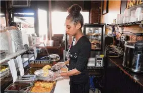  ?? ?? Angel Rivera prepares an order at Sandra's Next Generation on Congress Avenue in New Haven.