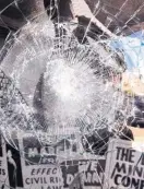  ?? COURTESY OF NEW MEXICO HOLOCAUST MUSEUM ?? A window at the New Mexico Holocaust Museum in Downtown Albuquerqu­e was shattered last week during the televised burial of U.S. Rep. John Lewis.