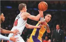  ?? AFP ?? Kyle Kuzma (right) of the Los Angeles Lakers passes past Lauri Markkanen of the Chicago Bulls during the second half of the game at Staples Center on Tuesday.