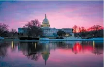  ?? ASSOCIATED PRESS FILE PHOTO ?? Dawn breaks over the Capitol in Washington last month. The once bipartisan drive to curb increases in health care premiums has devolved into a partisan struggle with escalating demands by each side. It’s unclear if they’ll be able to reach an agreement.