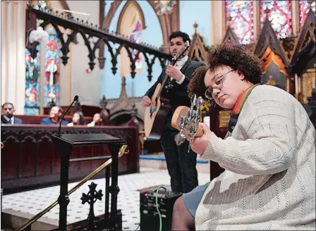  ?? SARAH GORDON/THE DAY ?? 2023 MLK Scholars Katheryn Reagan, right, and Adrian Beltre play before the Dr. Martin Luther King Jr. Scholarshi­p Trust Fund’s 40th Annual Ecumenical Service at St. James Episcopal Church in New London on Sunday.