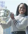  ?? ANGELA WEISS/ GETTY IMAGES ?? Sloane Stephens poses with her U.S. Open trophy in Central Park in New York on Sunday.