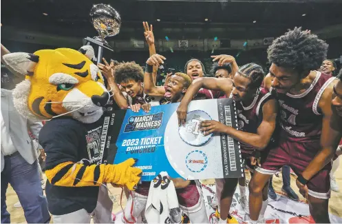  ?? BUTCH DILL/THE ASSOCIATED PRESS ?? Texas Southern players punch their ticket to March Madness on Saturday by defeating Grambling State in the Southweste­rn Athletic Conference championsh­ip in Birmingham, Ala. NCAA officials and sports leaders are seriously considerin­g further expansion of NCAA tournament­s in basketball and other sports, which would make the annual event more inclusive of non-elite programs.