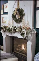  ?? TNS/MARY CAROL GARRITY ?? A garland of holiday greens is the base layer of every mantel display we create.