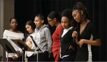  ?? ERIC BONZAR —T HE MORNING JOURNAL ?? A group of Southview Middle School history scholars recite Maya Angelou’s poem, “Phenomenal Woman,” during the school’s Black History Program to celebrate diversity Feb. 22, in Lorain.
