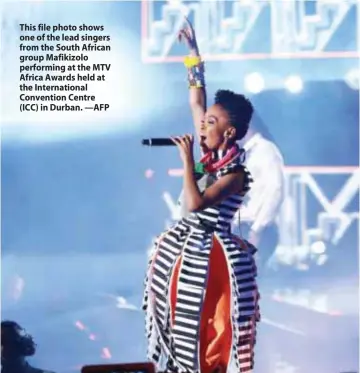  ?? —AFP ?? This file photo shows one of the lead singers from the South African group Mafikizolo performing at the MTV Africa Awards held at the Internatio­nal Convention Centre (ICC) in Durban.