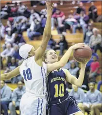  ??  ?? Albany’s Junasia Lanier, left, defends Averill Park’s Anna Jankovic, who had six points on Friday night.