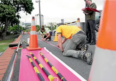  ?? CALEB SIRCOMBE ?? The pink line for this year’s Performanc­e Arcade is being laid down, ready for people to wander along and explore.