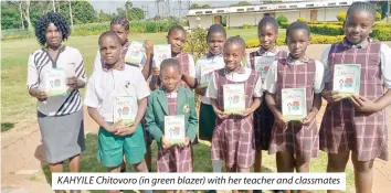  ?? ?? KAHYILE Chitovoro (in green blazer) with her teacher and classmates