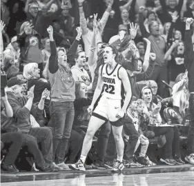  ?? JOSEPH CRESS/USA TODAY NETWORK ?? Iowa's Caitlin Clark celebrates after breaking the NCAA women's college basketball all-time scoring record on Thursday.