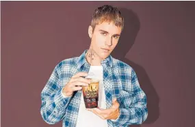  ?? TIM HORTONS VIA THE CANADIAN PRESS ?? Tim Hortons and Justin Bieber are back with a new French vanillafla­voured chilled coffee. Biebs Brew is the pop star's rendition of the coffee chain's cold brew coffee. The chilled coffee will be released next month alongside a limited-edition, stainless steel tumbler co-created by the Canadian performer.