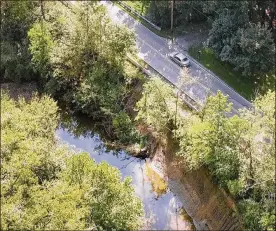  ?? TY GREENLEES / STAFF ?? “There is an imminent failure potential for the road. There is that hazard for the traveling public,” said senior county engineer Joseph Dura as county commission­ers approved a fix to damage caused by erosion for the second time this year.