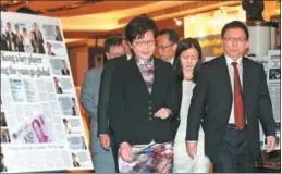  ?? EDMOND TANG / CHINA DAILY ?? Hong Kong Chief Executive Carrie Lam Cheng Yuet-ngor walks on Monday with Zhou Shuchun, publisher and editor-in-chief of China Daily, at a 20th anniversar­y event for the media group’s Hong Kong edition.