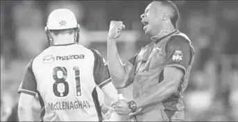  ??  ?? Kieron Pollard celebrates his first wicket of the final over in yesterday’s match against Sydney Thunder.